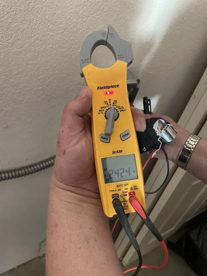 Voltage testing with clamp meter during Electrical Installation Services in North Brooksville